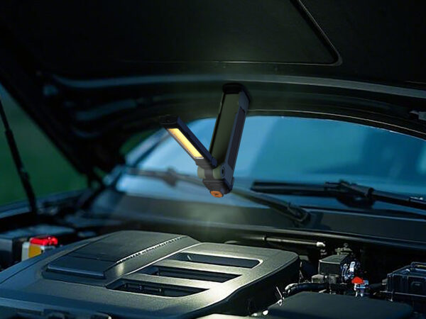 Car engine illuminated by portable LED light