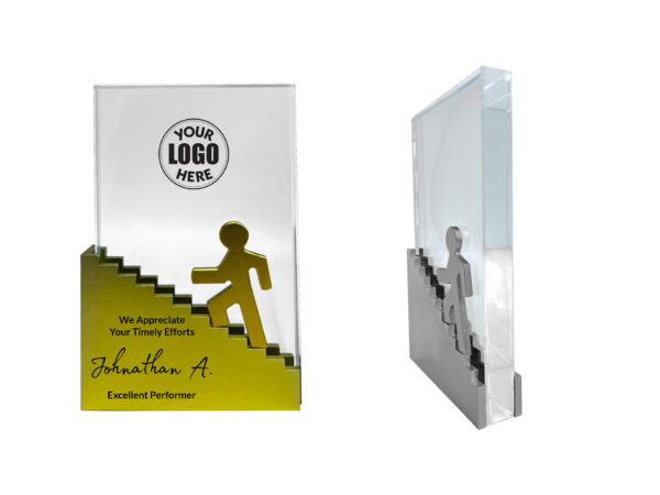 Award plaque with steps and silhouette figure.