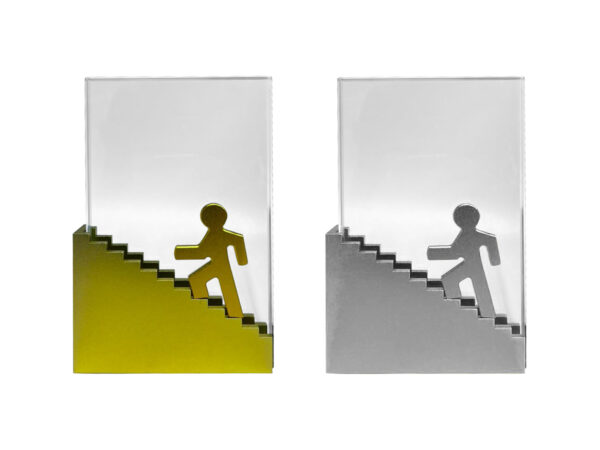 Trophy with figure ascending staircase design